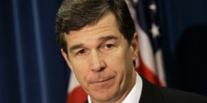 North Carolina Attorney General Roy Cooper discusses the results of an outside review of past serology practices at the North Carolina State Bureau of Investigation Laboratory during a press conference in Raleigh, N.C., Wednesday, Aug. 18, 2010. (AP Photo/Jim R. Bounds)